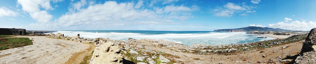 Panoramic view of sea against cloudy sky