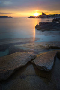 Scenic view of sea against sky during sunset