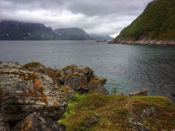 Scenic view of lake against cloudy sky