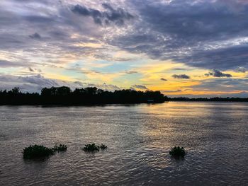 Scenic view of lake against sky during sunset