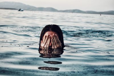 Portrait of person swimming in sea