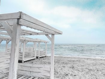 Built structure on beach against sky