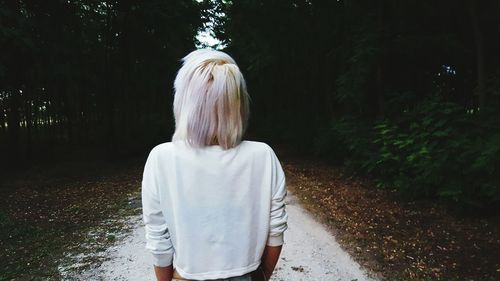 Rear view of woman walking in park