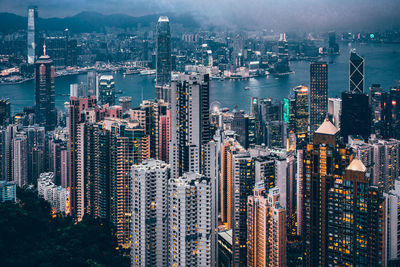 High angle view of modern buildings in city against sky