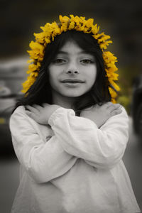 Portrait of beautiful woman with yellow flower