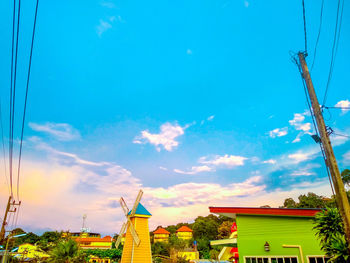 Low angle view of buildings against blue sky