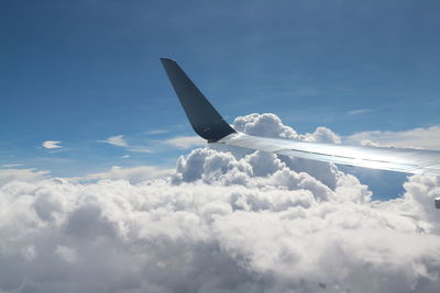 Low angle view of airplane flying in sky