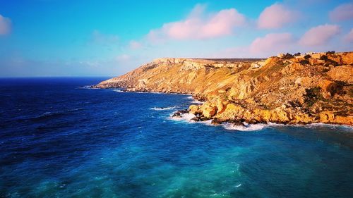 Scenic view of sea against blue sky