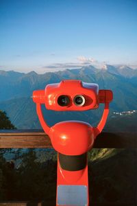 High angle view of man standing on mountain against sky