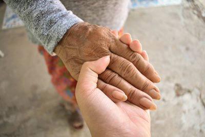 High angle view of people hands