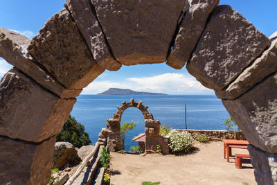 Rocky archway leading towards sea