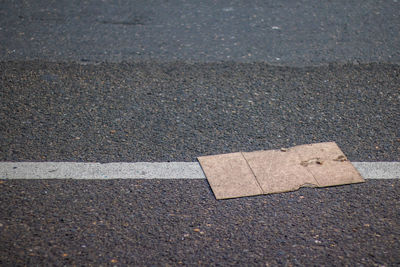 High angle view of cardboard on road