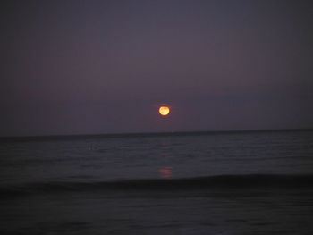 Scenic view of sea against sky at night