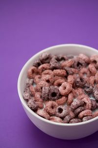 Close-up of food in bowl against pink background