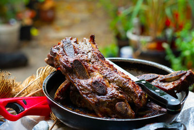 Close-up of meat on barbecue grill