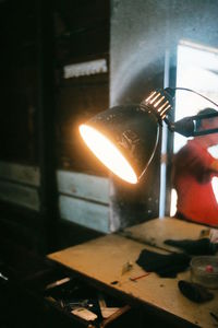 Close-up of person working at night