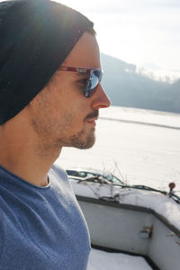 Portrait of young man looking at sea