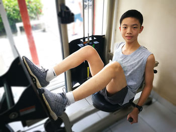 Portrait of boy exercising in gym