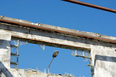 Low angle view of built structure against blue sky