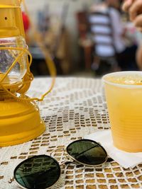 Close-up of yellow drink on table