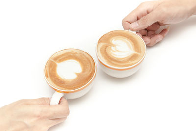 Hand holding coffee cup