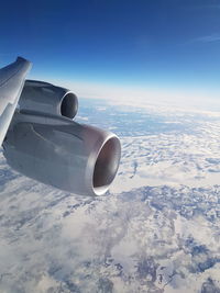 Close-up of airplane against sky