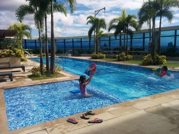 Boy playing in swimming pool