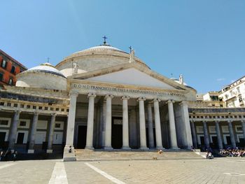 Facade of historic building against clear sky