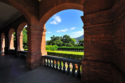 Corridor of building against sky