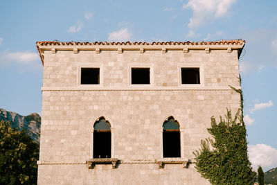 Low angle view of old building against sky