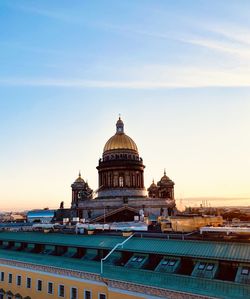 View of building against sky during sunset in city