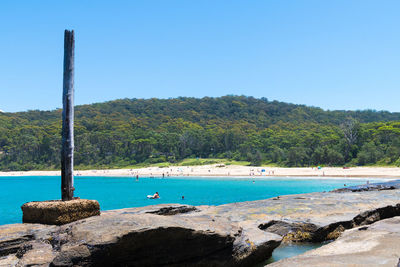 Scenic view of sea against clear blue sky