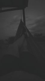 Low section of woman lying on bed