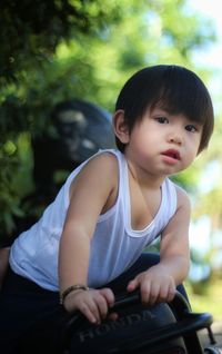 Cute girl looking away while sitting in car