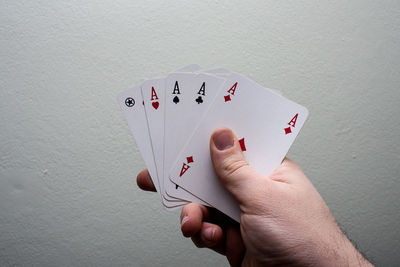 Close-up of hand playing with tattoo on table