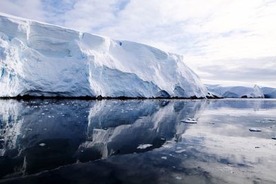 Scenic view of glacier against sky