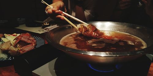 Midsection of person preparing food on table