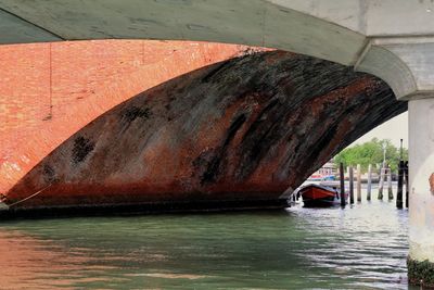 Boat sailing in sea by canal