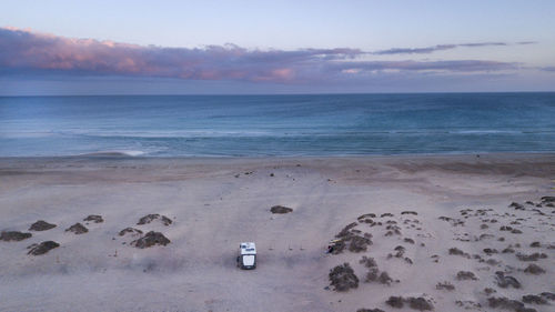 Aerial view of camper van on beach