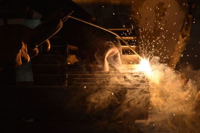Close-up of manual worker welding in metal industry