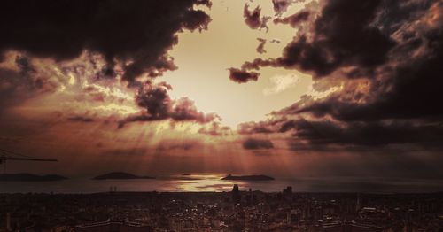 Scenic view of dramatic sky over sea during sunset