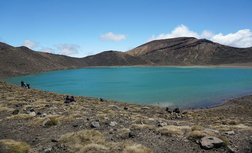 Scenic view of lake and mountains against sky