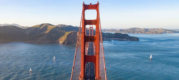 Golden gate bridge over bay against sky