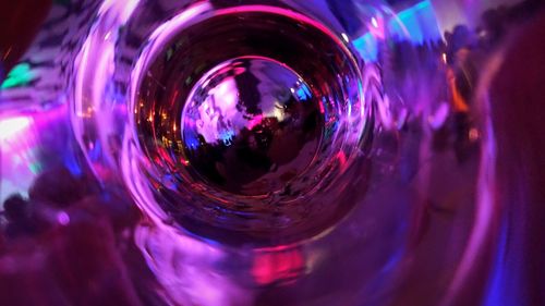 Close-up of multi colored reflection in illuminated mirror