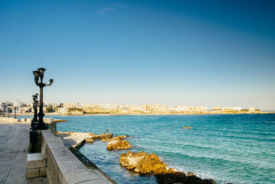 Scenic view of sea against clear blue sky