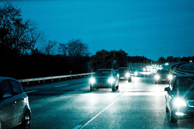 Cars on road at night