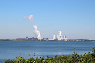 Panoramic view of factory against clear sky