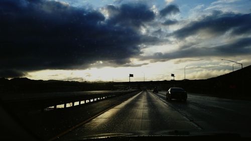 View of road against cloudy sky