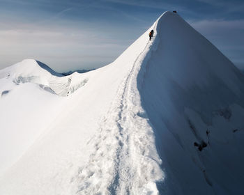 Snow covered mountain against sky