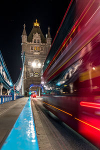 Illuminated light trails on road at night
